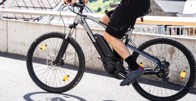 Man Riding E Bike Bicycle In City