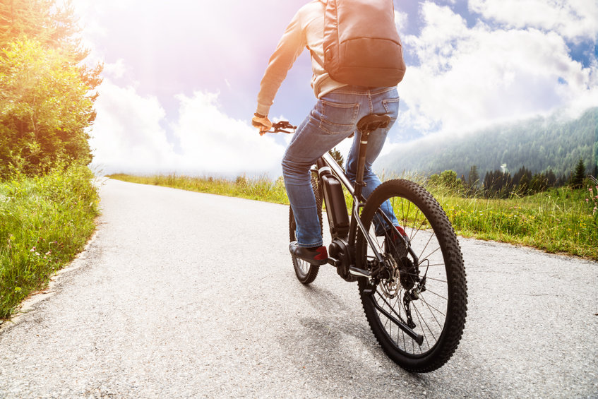 Man Riding Electric Mountain Bike